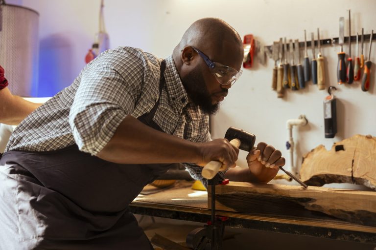 man-wears-safety-goggles-while-using-chisel-hammer-avoid-injury